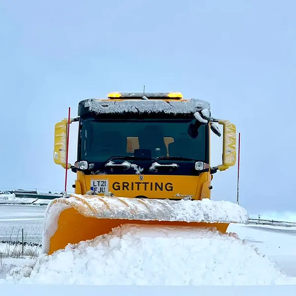 Snow plough clearing roads